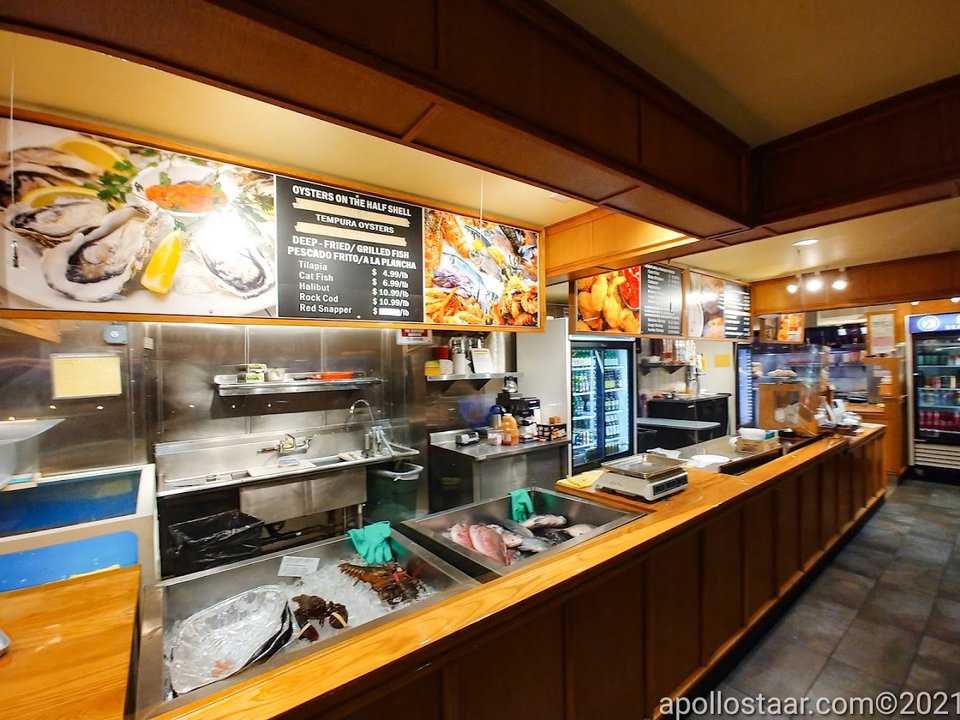 A simple restaurant interior with tables and chairs.